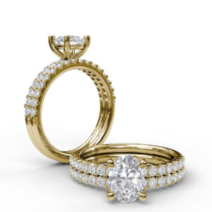 Classic Single Row Engagement ring with an Oval Center Diamond.