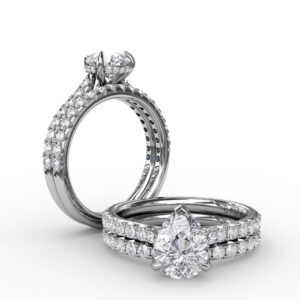 Classic Pear Shape Engagement Ring with a Subtle Diamond Splash