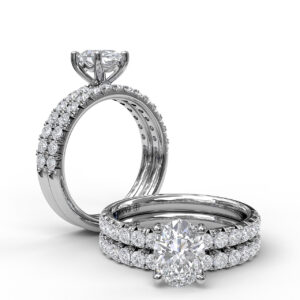 Oval Cut Solitaire With French Cut Pave