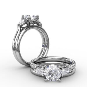 Classic Three-Stone Diamond Engagement Ring With Pear-Shape Side Diamonds