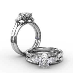 Classic Oval Three-Stone Diamond Engagement Ring With Pear-Shape Side Diamonds